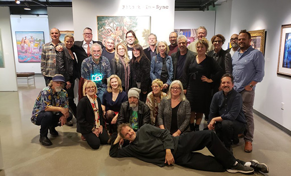 david lee and others pose for a photo in the coastline college art gallery