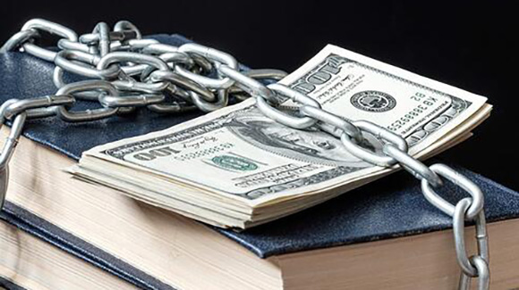 stack of money chained to stack of books