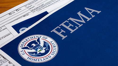 images of papers with a FEMA folder on top