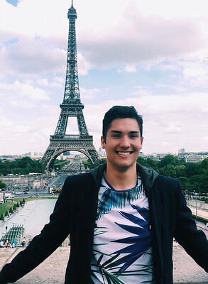 Jake Chustz in front of the Eiffel tower