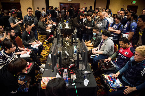 busy gaming competition with players and spectators gathered together