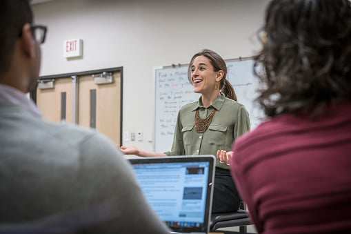 female teacher speaking to class
