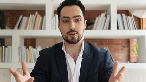 straight-on view of a professional young man speaking