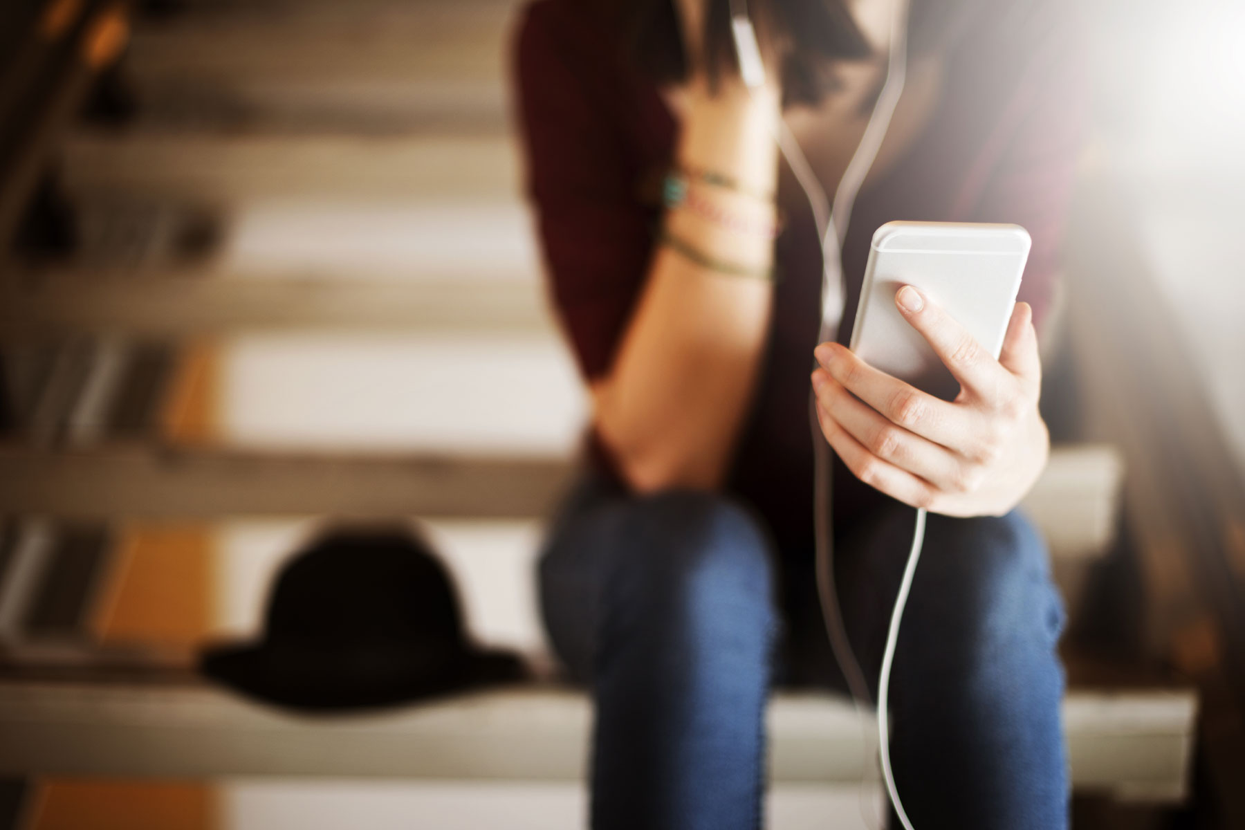 woman listening to podcast or music on her phone