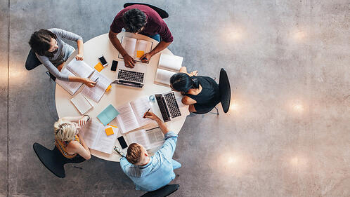 overhead view of a study group sitting around a round table