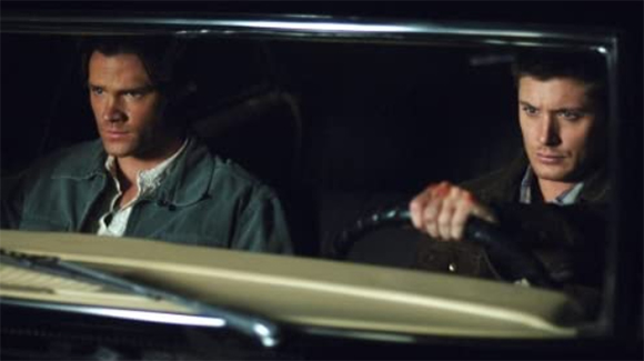 Characters Sam and Dean Winchester sit in their trusty Impala, Baby. Source: IMDB