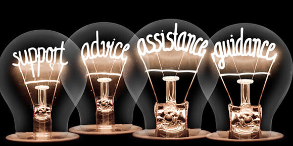 light bulbs group with shining fibers in a shape of SUPPORT, ADVICE, ASSISTANCE, GUIDANCE concept words isolated on black background