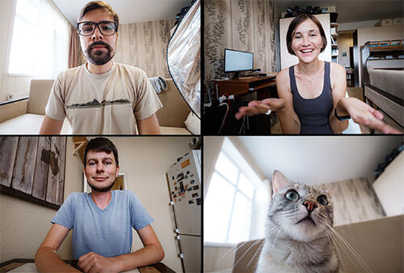 3 people and a cat shown on a Zoom call grid