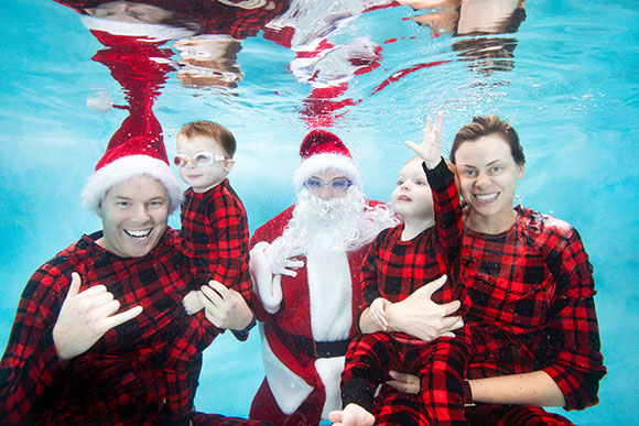 Professor Smith and her family take a unique underwater holiday portrait with Santa