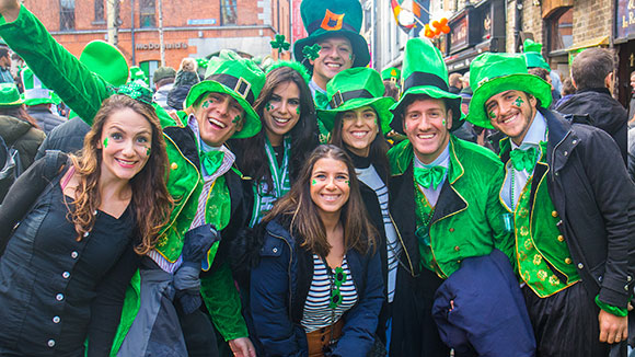 group of young people celebrating st. patrick's day at a parade