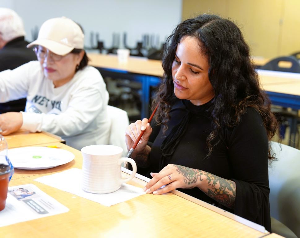 woman doing ceramic art shop work