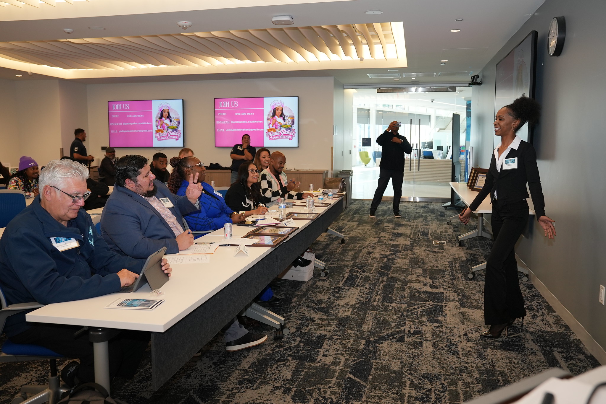 Student giving a pitch to a panel of judges