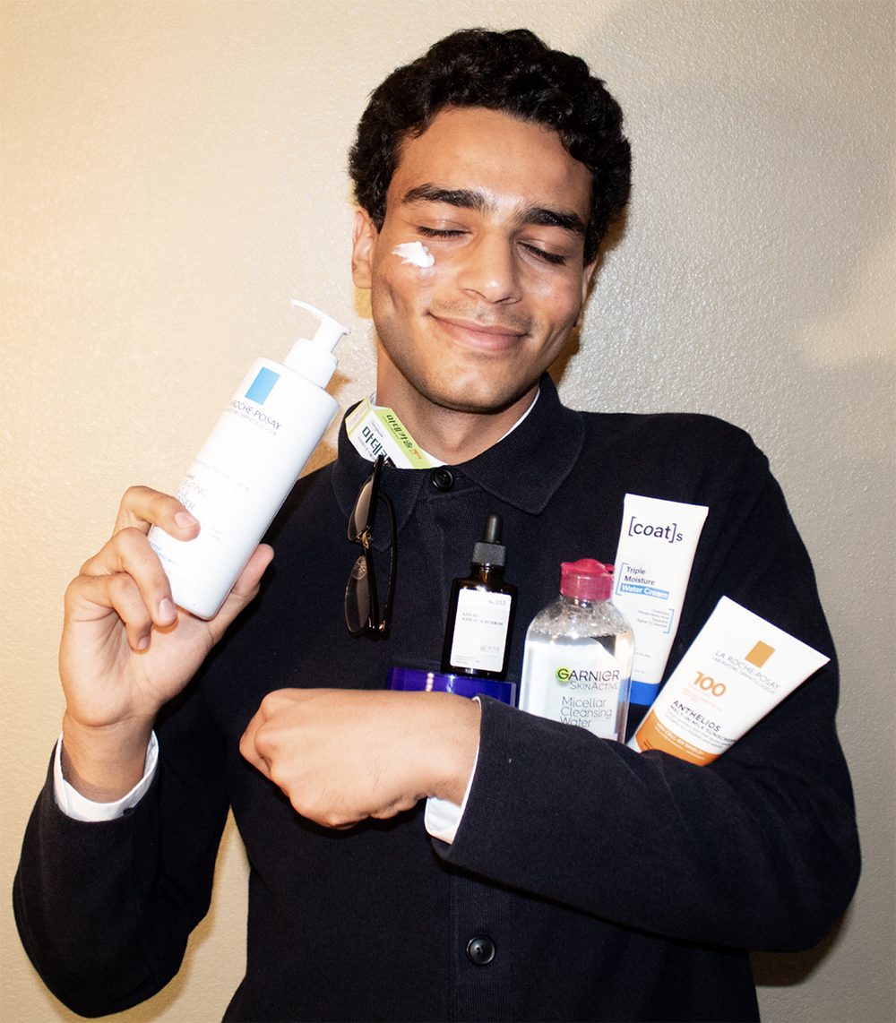 Ahmad Hamida holding skincare products